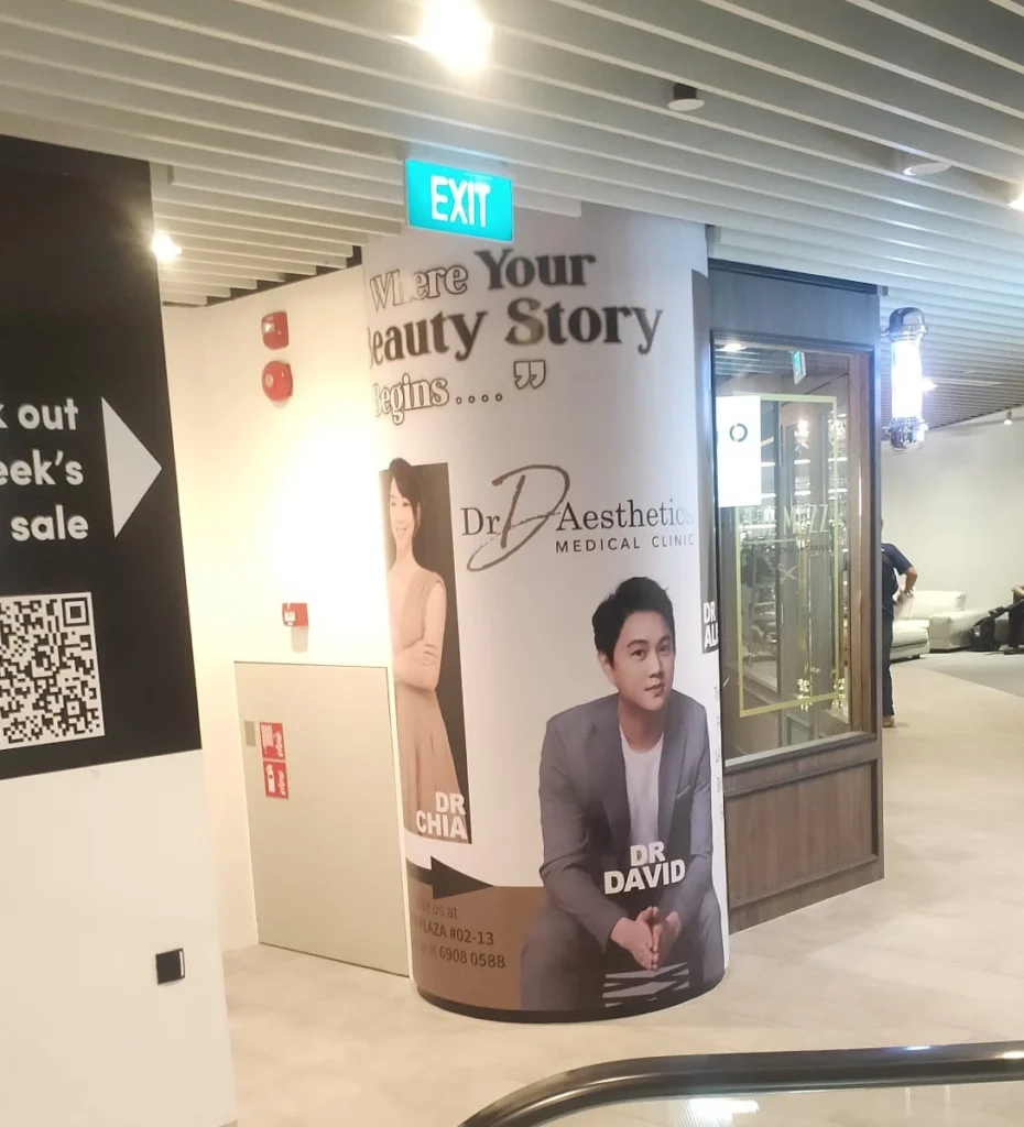 Dr D Aesthetic Medical Clinic pillar wrap dvertisement with doctors' photo