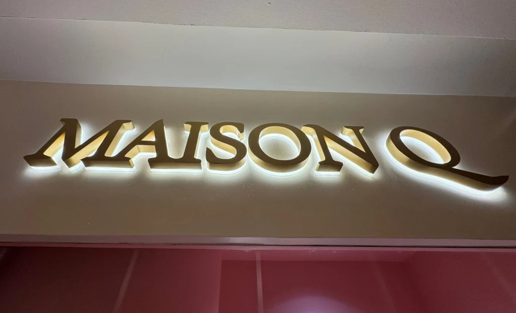 3D box-up signage for MAISON Q with sleek modern lighting