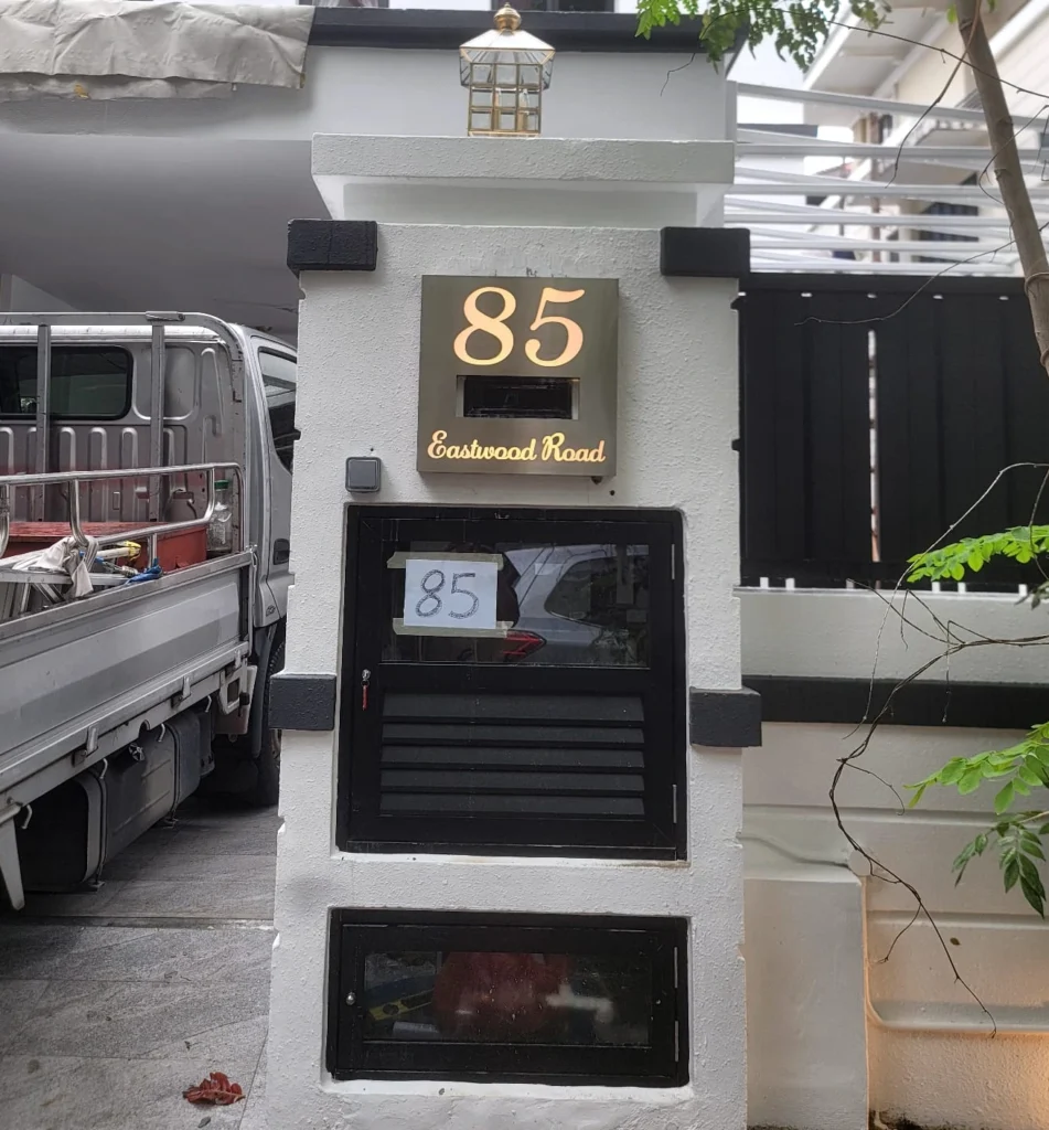 Lighted house signage at 85 Eastwood Road with elegant outdoor visibility