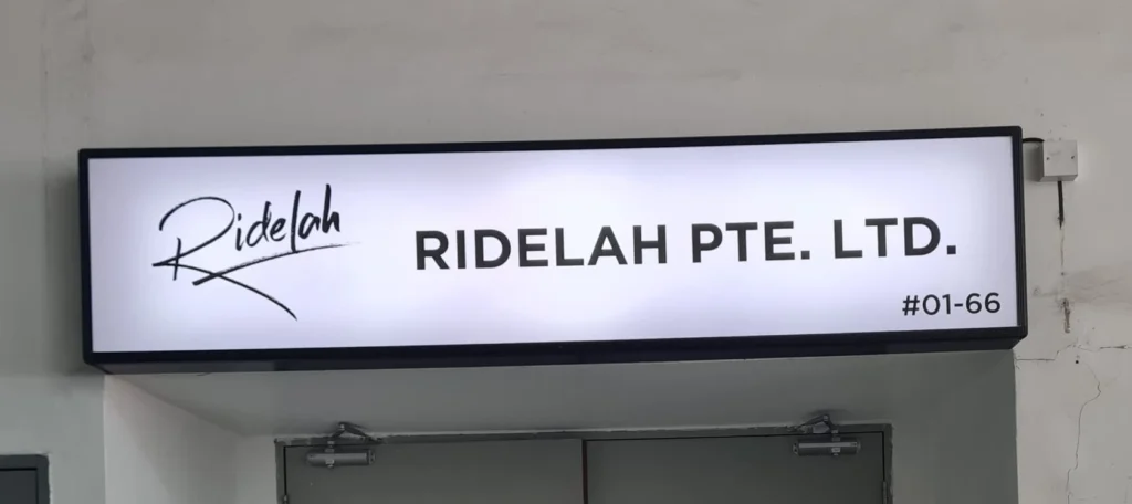 Lightbox signage for Ridelah Pte Ltd with bright illuminated display