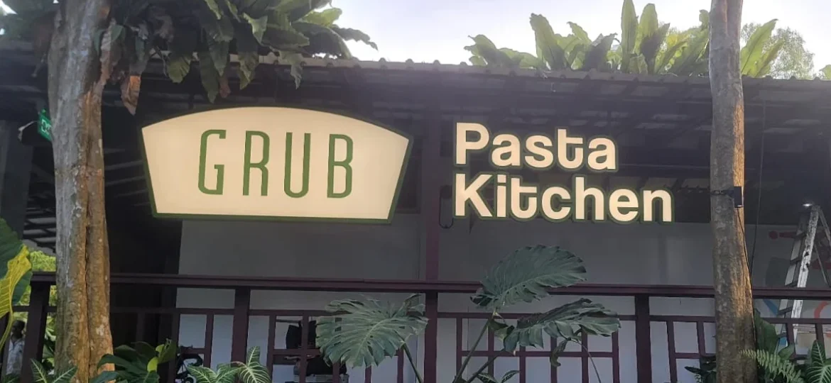 An illuminated outdoor storefront sign and 3D lettering for Grub Pasta Kitchen