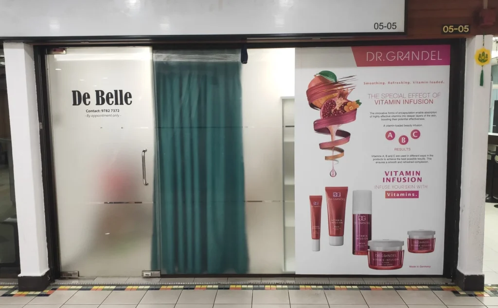 Glass stickers for shop window advertising, featuring the company logo and printed promotional poster